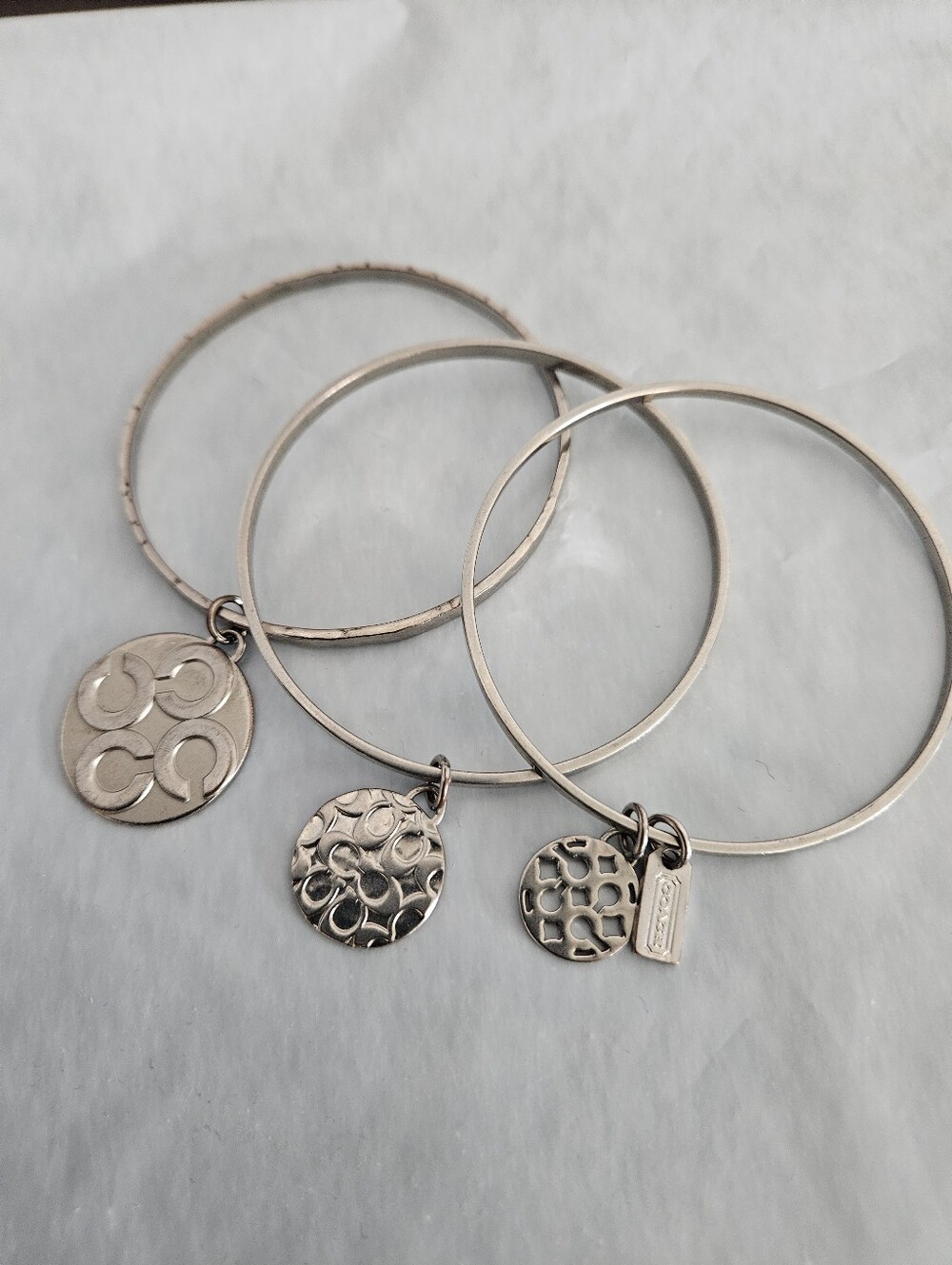 Coach Silver-Tone Stackable Signature C Charm Bangle Bracelet Trio Set